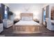 Calming main bedroom with wood floors, antler decor, and large windows for natural light at 170 Fowler St # 200, Woodstock, GA 30188