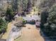 Ranch-style home features mature trees, large lawn, and covered front porch at 2218 Young Rd, Stone Mountain, GA 30088