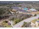 Aerial view showcasing the proximity of a wooded lot to a church, and commercial businesses at 2218 Young Rd, Stone Mountain, GA 30088