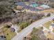 An aerial view of a wooded lot close to nearby commercial businesses and a church at 2218 Young Rd, Stone Mountain, GA 30088