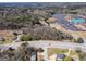 An aerial view of a wooded lot with road frontage near a business and a church at 2218 Young Rd, Stone Mountain, GA 30088