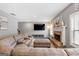 Open living space with a large TV and comfortable seating at 312 Maddi Grace Ct, Locust Grove, GA 30248