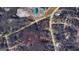 Aerial view of the lot surrounded by lush greenery, roadways, and nearby buildings at 1849 Panola Rd, Stone Mountain, GA 30088