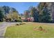 Charming single story home with large front yard, driveway and landscaping at 1849 Panola Rd, Stone Mountain, GA 30088