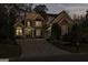 Charming two-story home with a well-manicured lawn, stone accents, and a welcoming entrance at 7085 Wakehurst Pl, Cumming, GA 30040