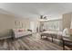 Large bedroom featuring a ceiling fan and daybed with wood-look flooring at 897 Winding Trl, Lawrenceville, GA 30046