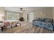 Bedroom featuring a daybed and ceiling fan with wood-look flooring at 897 Winding Trl, Lawrenceville, GA 30046