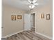 Bedroom features light-colored walls, wood-look flooring, and white trim at 897 Winding Trl, Lawrenceville, GA 30046