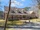 Exterior view with the home's front porch, siding and landscaping at 897 Winding Trl, Lawrenceville, GA 30046