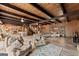 Spacious living room boasts a stone fireplace, hardwood floors, neutral colored furniture, and natural light at 897 Winding Trl, Lawrenceville, GA 30046