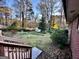 View of a large backyard with a shed and lots of open green space at 398 Lockridge Ln, Lawrenceville, GA 30046