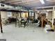 Unfinished basement with exposed ceiling and wooden staircase at 398 Lockridge Ln, Lawrenceville, GA 30046