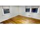 Bedroom features hardwood floors and bright windows with natural light at 398 Lockridge Ln, Lawrenceville, GA 30046