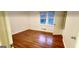 Bedroom with hardwood flooring, neutral walls, and natural light at 398 Lockridge Ln, Lawrenceville, GA 30046