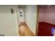 Hallway with hardwood floors leading to bedrooms at 398 Lockridge Ln, Lawrenceville, GA 30046