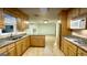 Traditional kitchen with warm wood cabinets, granite countertops, modern appliances, and an open layout at 398 Lockridge Ln, Lawrenceville, GA 30046