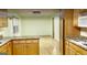 Bright kitchen with ample cabinet space, granite countertops, and a view into the dining area, great for entertaining at 398 Lockridge Ln, Lawrenceville, GA 30046