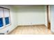 Bright living room features hardwood floors and large window for natural light at 398 Lockridge Ln, Lawrenceville, GA 30046