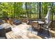 The back deck features a seating area with a table and chairs perfect for outdoor entertaining at 830 Turner Rd, Mcdonough, GA 30252