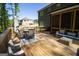 The back deck features a seating area with a table and chairs perfect for outdoor entertaining at 830 Turner Rd, Mcdonough, GA 30252