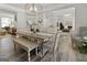 Bright dining room featuring a table with chairs, a bench and decor with view into the living area at 830 Turner Rd, Mcdonough, GA 30252