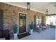 Inviting front porch featuring stylish decor, a welcome mat, and a cozy seating area at 830 Turner Rd, Mcdonough, GA 30252