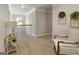 Upstairs hallway with a decorative chair, stairway, and wreaths at 830 Turner Rd, Mcdonough, GA 30252