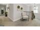 Upstairs hallway featuring a decorative chair, stairway, and wreaths at 830 Turner Rd, Mcdonough, GA 30252
