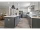 Contemporary kitchen with stainless appliances, a gray island, and modern pendant lighting at 830 Turner Rd, Mcdonough, GA 30252