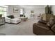 Cozy living room with plush carpeting, comfortable seating, and ambient lighting for a relaxing atmosphere at 830 Turner Rd, Mcdonough, GA 30252