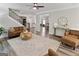 Open-concept living room with hardwood floors seamlessly connecting to the kitchen and dining area at 830 Turner Rd, Mcdonough, GA 30252