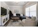 Comfortable living room with a plush sectional sofa, decorative pillows, and a cozy ottoman at 830 Turner Rd, Mcdonough, GA 30252