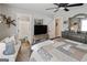 Comfortable main bedroom featuring a decorative ceiling fan, adjacent bathroom, and coordinating furniture at 830 Turner Rd, Mcdonough, GA 30252