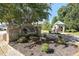Stone 'Oakleaf' community sign with manicured landscaping and a covered gazebo at 2478 Oakleaf Rdg, Lithonia, GA 30058
