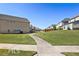 Residential street with a sidewalk, green lawns, and well-maintained houses in the distance at 2478 Oakleaf Rdg, Lithonia, GA 30058