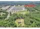 Aerial view of property near Henry Town Center in a wooded area at 133 Harold Dr, Mcdonough, GA 30253