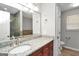Bright bathroom featuring a vanity with granite countertop, ample lighting and tile floors at 133 Harold Dr, Mcdonough, GA 30253