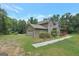 Charming two-story home featuring a stone chimney, side entry garage and lush landscaping at 133 Harold Dr, Mcdonough, GA 30253