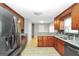Well-equipped kitchen with granite countertops, stainless steel appliances and tile floors at 133 Harold Dr, Mcdonough, GA 30253