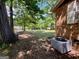 Backyard view with mature trees, showing ample space and greenery extending beyond the home at 360 Meadowbrook Dr, Mcdonough, GA 30253