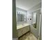 Bathroom with vanity, a large mirror with accent lighting, and tile floors at 360 Meadowbrook Dr, Mcdonough, GA 30253