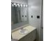 Bathroom with white sink, laminate countertops, and a large mirror at 360 Meadowbrook Dr, Mcdonough, GA 30253