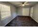 Bedroom with carpet, a ceiling fan, a window, a closet, and neutral wall color at 360 Meadowbrook Dr, Mcdonough, GA 30253