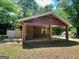 Spacious open carport constructed of brick pillars offering covered parking or an outdoor gathering space at 360 Meadowbrook Dr, Mcdonough, GA 30253
