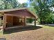 Open carport with brick pillars offering covered parking and protection from the elements at 360 Meadowbrook Dr, Mcdonough, GA 30253