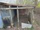 Chicken coop with a metal door and wire mesh at 360 Meadowbrook Dr, Mcdonough, GA 30253