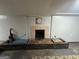 A view of the basement fireplace needing repair or updating, and storage space at 360 Meadowbrook Dr, Mcdonough, GA 30253