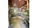 Interior view of cinder block walls, painted murals, and window to outside at 360 Meadowbrook Dr, Mcdonough, GA 30253