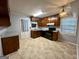 Functional kitchen with dark cabinetry, laminate countertops, and a tiled floor at 360 Meadowbrook Dr, Mcdonough, GA 30253