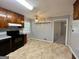 Traditional kitchen with wood cabinets, tile flooring, stainless appliances, and natural light at 360 Meadowbrook Dr, Mcdonough, GA 30253